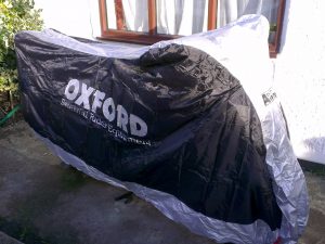 Rain covers for motorcycle theft prevention