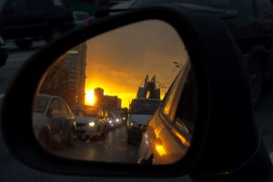 33928928 - view on the car mirror on the traffic jam and sunrise