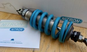 Nitron motorcycle shock in trademark Nitron blue